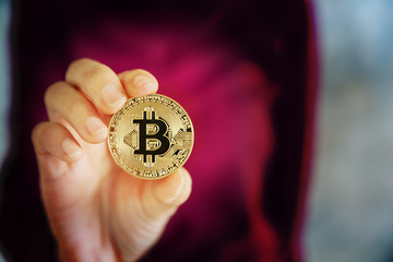 Fototapeta na wymiar woman holding bitcoin