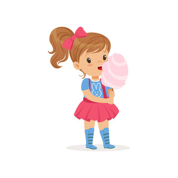Lovely toddler kid eating sweet cotton candy on stick. Brown-haired girl with ponytail in blue t-shirt with bunny print and pink skirt with suspenders. Flat vector design