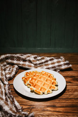 Belgian waffles on a wooden table