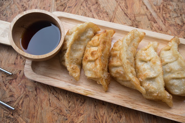 Gyoza on wooden plate