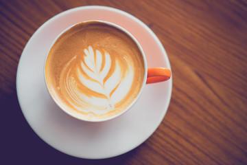 Top view of Cup of coffee latte art in coffee shop.