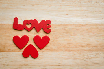 Love heart Valentine on a wooden background.