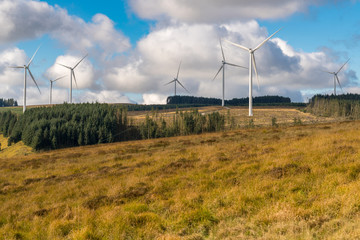 Fototapeta na wymiar Wind turbines on a field near Blaenrhondda in Rhondda Cynon Taf, Mid Glamorgan, Wales, UK
