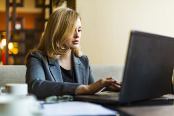 Shot of an attractive mature businesswoman working on laptop in her workstation.
