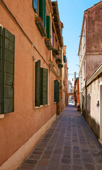 Venice, Italy - August 14, 2017: The narrow cozy streets of Venice.