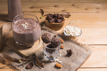 Glass of chocolate milk on table