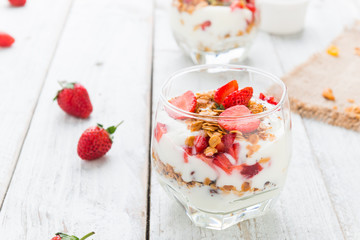 Strawberry , granola and yogurt healthy breakfast parfait