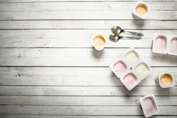 Fruit yogurt with spoons.