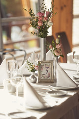 Luxury wedding setting table with number for guests