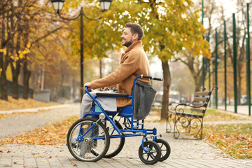 Young man in wheelchair outdoors