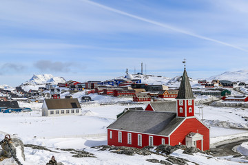 Annaassisitta Oqaluffia, church of our Saviour among snow in Historical center of Nuuk, Greenland © vadim.nefedov