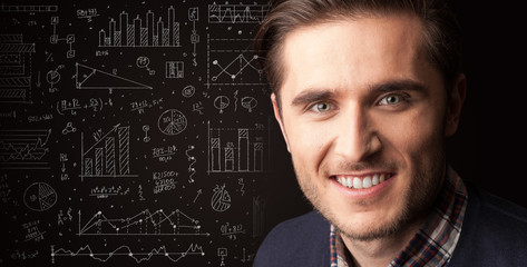 Portrait of a young businessman on dark background