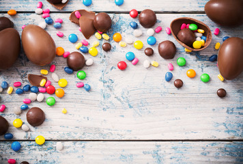 Chocolate Easter Eggs Over Wooden Background
