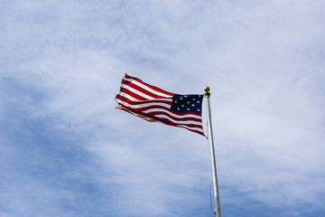 American Flag on the blue sky.