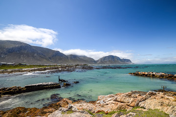 Fototapeta na wymiar Panoramic view of Stony Point Nature Reserve in Betty's Bay near Cape Town, South Africa. It is home to one of the largest successful breeding colonies of African Penguin in the world.