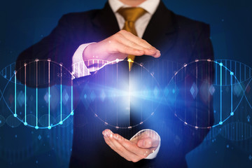 Businessman holding DNA