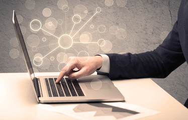 Science worker typing on laptop computer