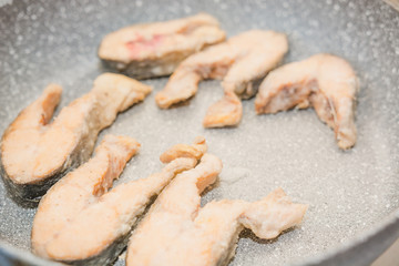 Fish to be pan fried. Slices of fried fish. Fish in flour to be pan fried.