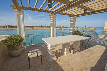 Exterior outdoor dining area of luxury tropical villa