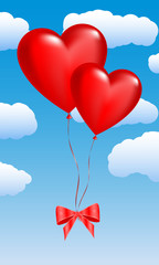 Fototapeta na wymiar Two balloons in the shape of hearts on a sky