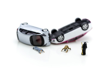 Miniature people : tiny toys car crash accident damaged with angle of death.