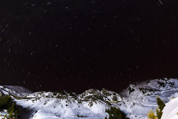 Star trails in the sky over the mountain