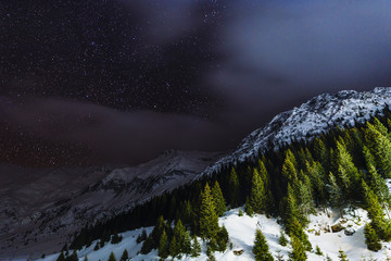Sky night with stars in the mountains during the winter
