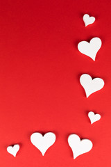 frame with white hearts on red background