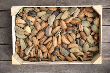 Wooden box of almonds in their shells