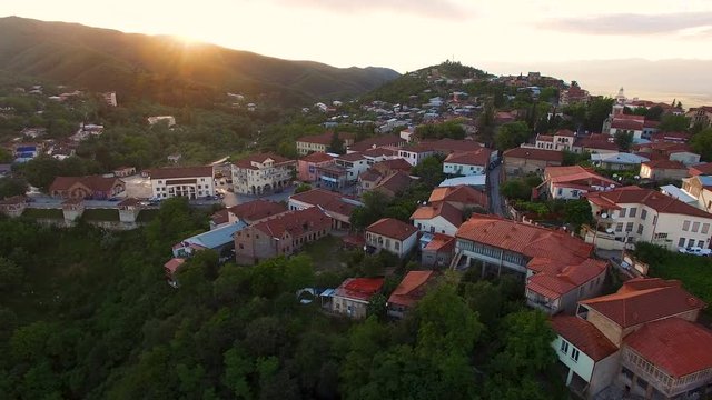 Magical aerial view of beautiful Sighnaghi town located on hills, golden hour