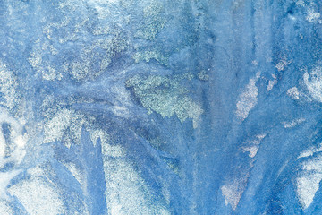 Frosty pattern on the window. Beautiful natural background. Winter theme. Close-up