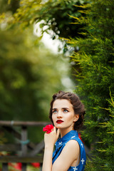 girl with red lips in blue dress