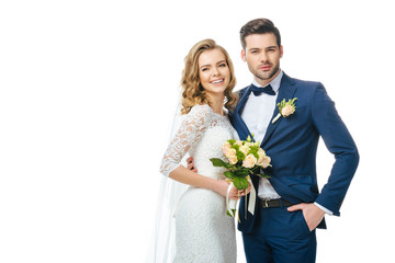 portrait of smiling bride with wedding bouquet and groom isolated on white - obrazy, fototapety, plakaty