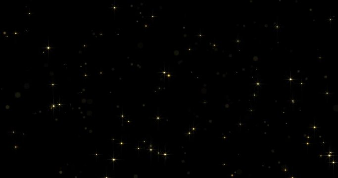 Abstract gold particles and sparkling stars or shimmering light effect background. Light flare shine or golden glare overlay effect for luxury premium product award design or Christmas backdrop