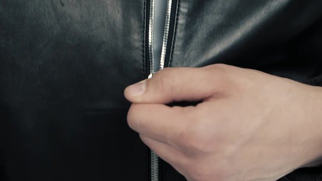 close-up of leather jacket details on dancing man and woman