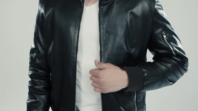 close-up of leather jacket details on dancing man and woman