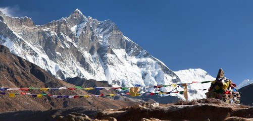 view of Lhotse peak with buddhist prayer flags