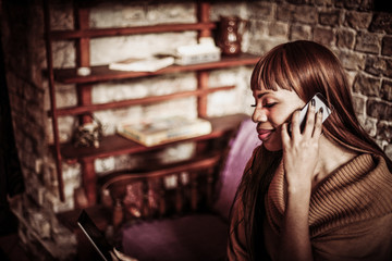 Woman using smart phone. African ethnicity.