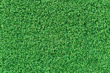 Fototapeta premium Green grass texture or green grass background for golf course. soccer field or sports background concept design. Artificial green grass.