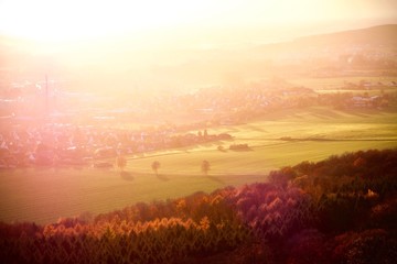Warm colors of sunset air over town in countryside