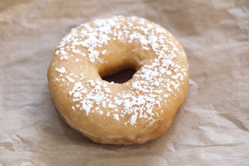 Doughnut on kraft paper.