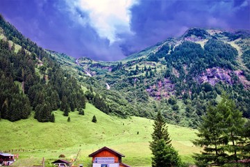 Fototapeta na wymiar distant hills after a storm under a dark blue brooding sky at K‰ferertal, Austria