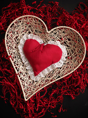 Red heart shape on shredded paper