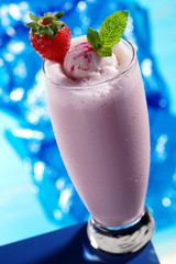 strawberry milkshake on blue