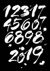 set of calligraphic acrylic or ink numbers. ABC for your design, brush lettering on a black background with blots