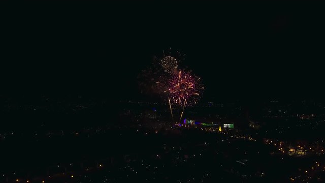 aerial shot : firework celebration over city downtown