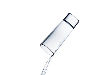 water spilling from glass isolated on white