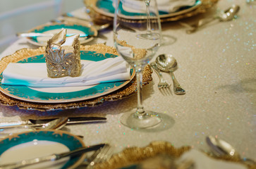 Fototapeta na wymiar table setting with gold leaf