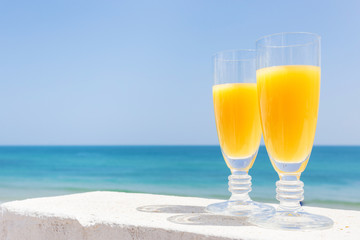 Orange juice by the sea