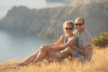 Romantic couple have a date at the top of the mountains with ocean view